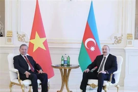Генеральный секретарь ЦК Коммунистической партии Вьетнама (КПВ) То Лам (слева) и президент Азербайджана Ильхам Алиев. (Фото: ВИA)