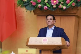 Премьер-министр Фам Минь Тьинь завершил заседание правительства 5 октября. (Фото: ВИA)