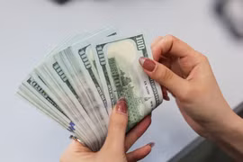 Согласно проекту директивы SBV, о электронных переводах от 1000 долларов США во вьетнамском IFC необходимо сообщать. (Фото: ВИA)