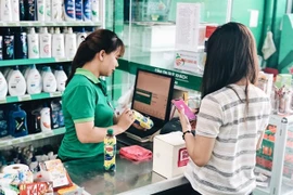 Клиент оплачивает свой счет в Co.op Mart в городе Хошимин при помощи Momo. (Фото любезно предоставлено Momo)