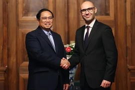 Премьер-министр Фам Минь Тьинь (слева) и генеральный секретарь СПС Марчин Чепелак (Фото: ВИА)