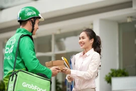 Сервис быстрой доставки еды GrabFood продолжает работать во всех городах, кроме Дананга. (Фото: Grab)