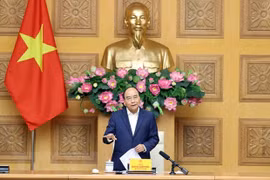 Премьер-министр Нгуен Суан Фук выступает на встрече. (Фото: ВИА)