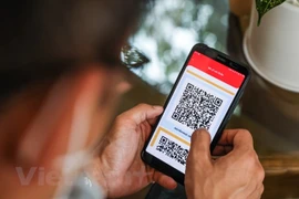 Каждому жителю после вакцинации будет выдан QR-код. (Фото: Vietnam +)