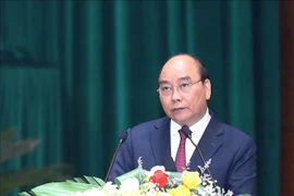 Президент государства Нгуен Суан Фук выступил с речью на конференции . (Фото: Чонг Дык/ВИА)
