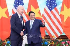 Премьер-министр Фам Минь Тьинь на встрече с президентом США Джо Байденом. (Фото: Зыонг Жанг/ВИА)