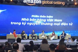 Г-жа Лай Вьет Ань и другие спикеры обсуждали на Неделе Amazon 2022. (Фото: Vietnam+)