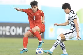 Вьетнам U23 (в красном) сыграл вничью 1:1 с U23 РК во втором матче группы C финального турнира Кубка Азии U23 2022 года, 5 июня. (Фото: ВИА)