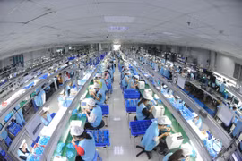 Производственная линия по выпуску электронной продукции на предприятии Suntech в промышленном кластере Тханьван. Фото: ВИА