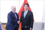 Президент Лыонг Кыонг принимает сенатора США Криса Кунса. (Фото: ВИА)