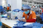 Производство одежды на экспорт на швейной компании Hung Viet, провинция Хынгйен. (Фото: ВИA)
