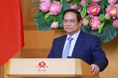 Премьер-министр Фам Минь Тьинь выступает на встрече с представителями американских компаний, инвестирующих и ведущих бизнес во Вьетнаме (Фото: ВИА)