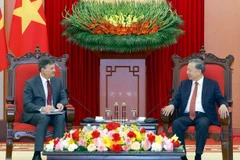 Генсекретарь То Лам принял директора Президентской академии РФ Алексея Комиссарова (Фото: ВИА)