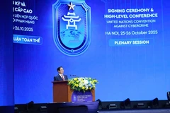Премьер-министр Фам Минь Тьинь выступил с вступительным докладом на первом пленарном заседании высокого уровня в рамках церемонии открытия подписания Ханойской конвенции (Фото: ВИА)