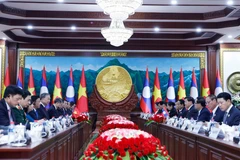 Генсекретарь То Лам провел переговоры с Генсекретарем и Президентом Тонглуаном Сисулисом (Фото: ВИА) 