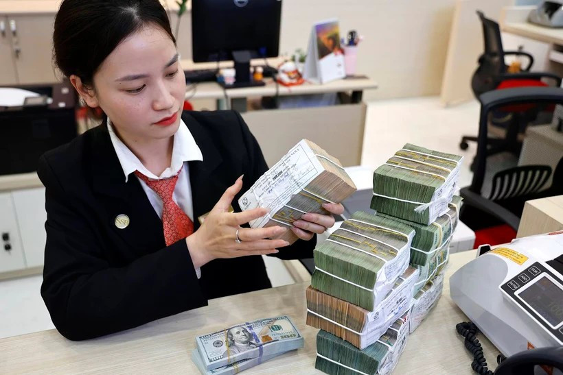 Банки реализуют множество кредитных решений, сопровождая бизнес. (Фото: Vietnam+)