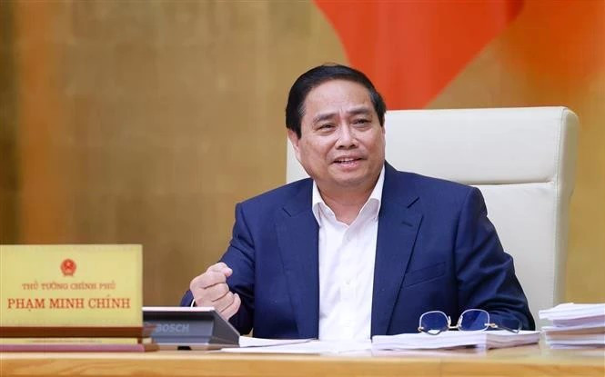 Премьер-министр Фам Минь Тьинь выступает на заседании правительства по законотворчеству в Ханое 22 мая. (Фото: ВИA)