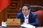 Премьер-министр Фам Минь Тьинь проводит заседание постоянно действующего состава Правительства с руководителями регионов по устранению трудностей и препятствий при реализации незавершённых проектов. (Фото: ВИА)