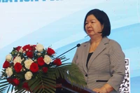 Председатель Союза кооперативов Вьетнама Као Суан Тху Ван выступает на семинаре 2 декабря. (Фото: ВИА) 