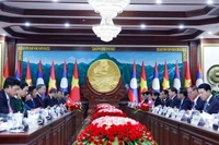 Генсекретарь То Лам провел переговоры с Генсекретарем и Президентом Тонглуаном Сисулисом (Фото: ВИА) 