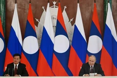 Президент России Владимир Путин и президент Лаоса Тонглун Сисулит выступили с заявлениями по итогам переговоров. (Фото: en.kremlin.ru)