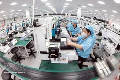 Производственный процесс в компании Khvatec Thai Nguyen Co., Ltd. в промышленном парке Йенбинь провинции Тхайнгуен. Фото: ВИА. 