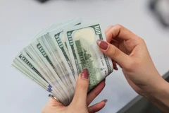 Согласно проекту директивы SBV, о электронных переводах от 1000 долларов США во вьетнамском IFC необходимо сообщать. (Фото: ВИA)
