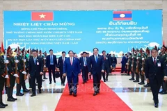 Премьер-министр Фам Минь Тьинь и Премьер-министр Лаоса Сонексай Сипхандон совместно председательствуют на 48-м заседании Межправительственного коммитета Вьетнам – Лаос. (Фото: ВИА).