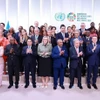 Премьер-министр Фам Минь Тьинь и главы делегаций, участвующих в UNOC 3, позируют для группового фото (Фото: ВИА)