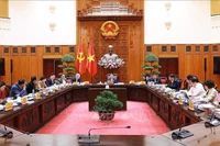 Премьер-министр Фам Минь Тьинь председательствует на заседании Постоянного комитета Правительства по развитию Проекта зоны свободной торговли и национального центра нефтепереработки и энергетики в Зунгкуате. Фото: ВИА.