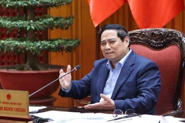 Премьер-министр Фам Минь Тьинь председательствует на заседании. Фото: ВИА.