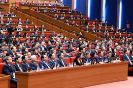 Делегаты участвуют в пленарном заседании по обсуждению документов партийного съезда, утром 21 января. Фото: ВИА