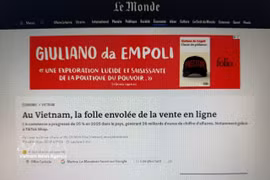 Статья французской газеты Le Monde посвящена нынешним высоким темпам роста экономики Вьетнама, в которой электронная коммерция становится не только новой потребительской тенденцией, но и важным драйвером экономического развития страны. (Фото: ВИА).