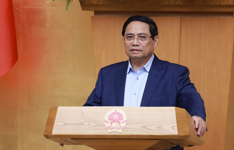 Премьер-министр Фам Минь Тьинь председательствует на специальном заседании Правительства по созданию Международного финансового центра во Вьетнаме. (Фото: ВИА)