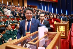 Делегаты голосуют за избрание Центрального комитета КПВ XIV созыва. (Фото: ВИА)