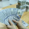 Справочный курс доллара США установлен на уровне 25 627 донгов за доллар по состоянию на 26 октября. Фото: ВИА.