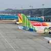 Самолеты вьетнамских авиакомпаний в Международном аэропорту Нойбай. (Фото: ВИА) 