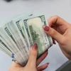 Согласно проекту директивы SBV, о электронных переводах от 1000 долларов США во вьетнамском IFC необходимо сообщать. (Фото: ВИA)