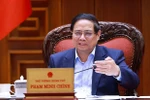 Премьер-министр Фам Минь Тьинь председательствовал на заседании Постоянного комитета Правительства с по вопросам создания Международного финансового центра во Вьетнаме. Фото: ВИА.