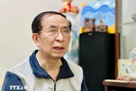Нгуен Винь Куанг, заместителем председателя Общества вьетнамско-китайской дружбы отвечает на интервью (фото: ВИА)