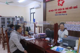 Граждане приходят для прохождения административных процедур в единый отдел общины Нгилонг (Нгилок, Нгеан) (Иллюстрация фото: ВИА)