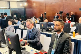 Международные представители наблюдают за работой XIV съезда в Национальном конференц-центре (Фото: ВИА)