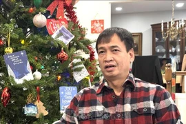 Юрист Данг Тьен Тханг, проживающий в городе Роквилл, штат Мэриленд, поделился своими впечатлениями с корреспондентом ВИА о XIV съезде КПВ (Фото: ВИА) 