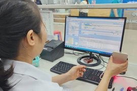 Медицинские учреждения активизируют работу по цифровой трансформации, создавая удобства для пациентов. (Фото: ВИА/Vietnam+)
