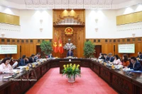 Премьер-министр Фам Минь Тьинь председательствует на третьем заседании Национального руководящего комитета по всеобъемлющему финансированию. (Фото: ВИА)