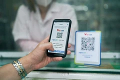 За последние 9 месяцев на внутреннем рынке объём платежей через QR-код резко вырос на 150%. (Фото: Vietnam+)