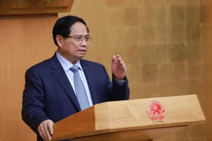 Премьер-министр Фам Минь Тьинь возглавляет заседание по оценке результатов функционирования Двухуровневой модели местной администрации. Фото: ВИА.