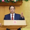 Премьер-министр Фам Минь Тьинь подводит итоги очередного заседания Правительства за март 2026 года и онлайн-конференции Правительства с местными органами власти. (Фото: ВИА)
