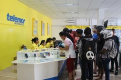 Люди в Восточном Тиморе регистрируются на 4G SIM-карту Viettel. (Фото: enternews.vn)