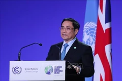 Премьер-министр Фам Минь Тьинь выступает на COP26. (Фото: ВИA)